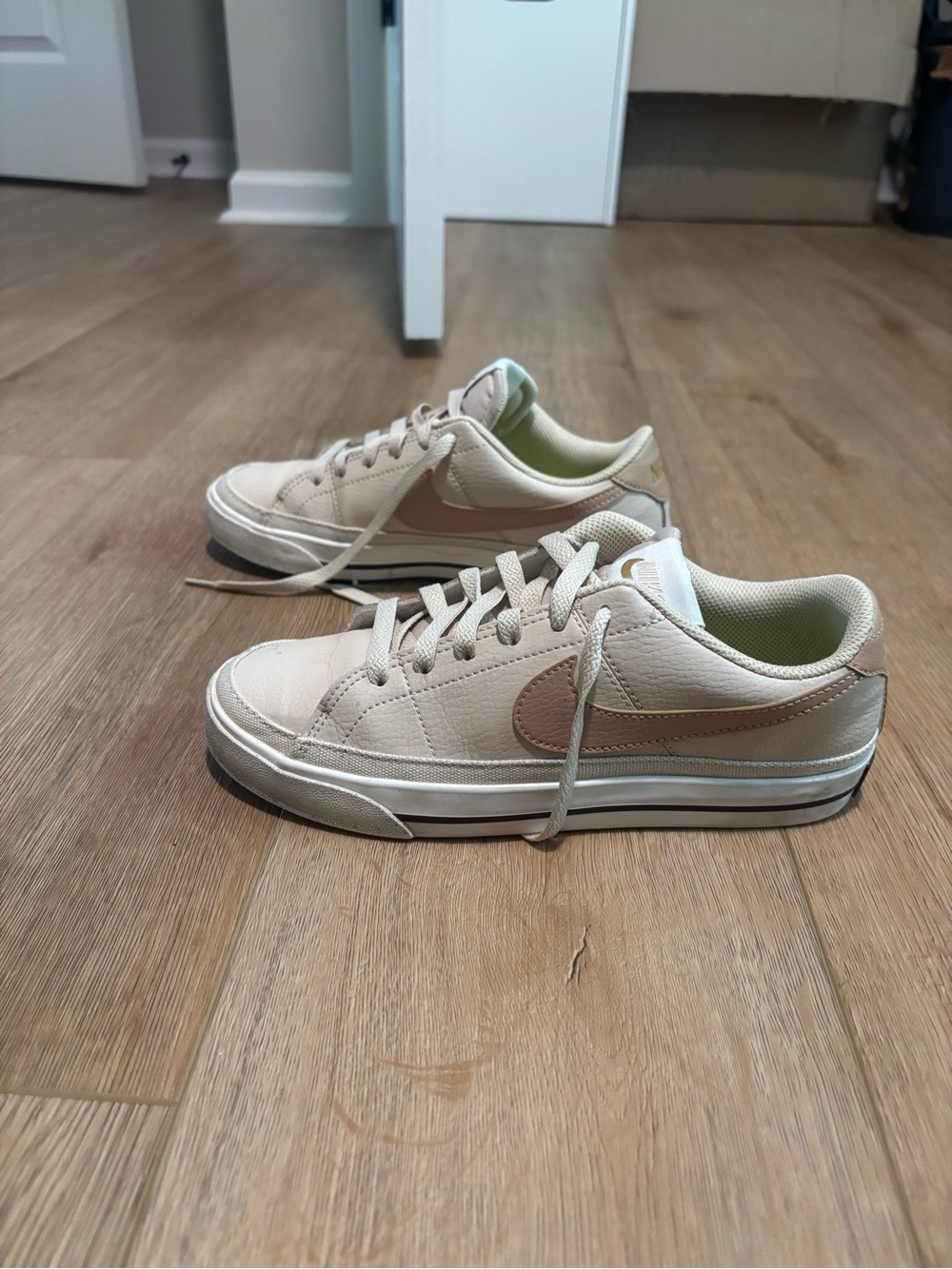 Women’s Nike court legacy next nature sand drift bronzine